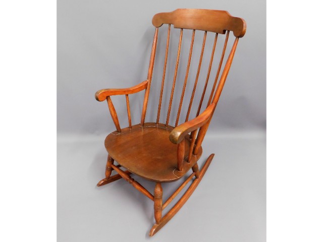 A stained rocking chair, 40.5in high to back