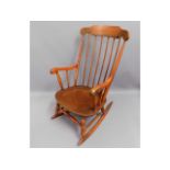 A stained rocking chair, 40.5in high to back