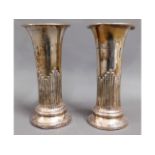 A pair of silver posy holders, some faults, 306g l