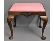 An antique mahogany piano stool with cabriole legs, 17.5in high £5-10