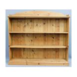 A large pine bookcase, 59.5in wide x 54.5in high x 11.875in deep £60-80