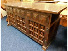 A 20thC. oak sideboard with three cupboards & three drawers, 62in wide x 29.125in high x 18.375in de