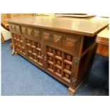 A 20thC. oak sideboard with three cupboards & three drawers, 62in wide x 29.125in high x 18.375in de