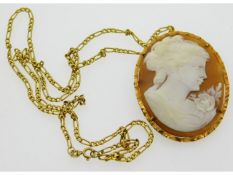 A 9ct gold 20in necklace with well carved cameo pe