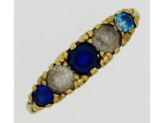 A 9ct gold ring set with paste stones, 2.9g, size