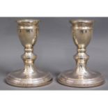 A pair of silver candlesticks, 277g loaded, 4in hi