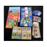 Four child's annuals, a quantity of Pokeman cards