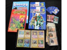 Four child's annuals, a quantity of Pokeman cards