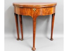 A George II mahogany tea table with folding top, 29.5in diameter x 28.75in high £100-150