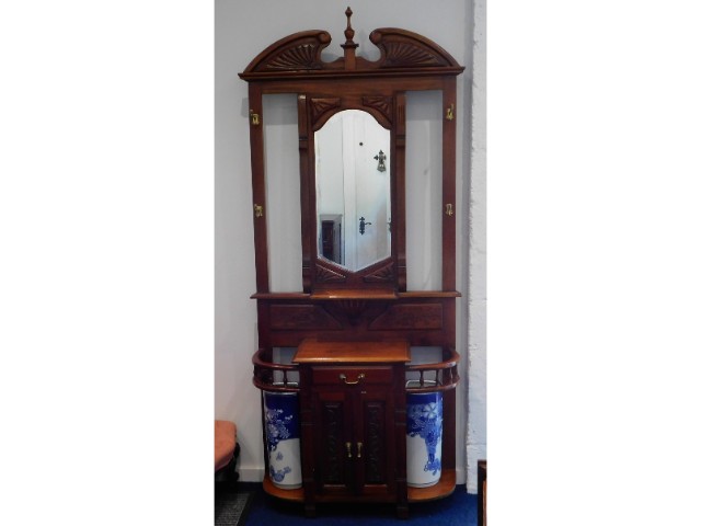 A reproduction hallstand with porcelain stick stan