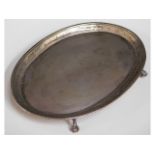 An antique silver (tested) footed tray with claw f