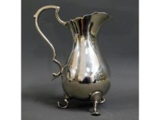 A Mappin & Webb silver cream jug, 208.9g. 5.5in ta