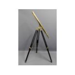 A 20thC. brass telescope with wooden tripod stand, telescope measures 39.375in long £30-40