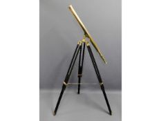 A 20thC. brass telescope with wooden tripod stand, telescope measures 39.375in long £30-40