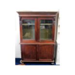 A Victorian bookcase with cupboards under, 48.5in