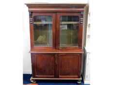A Victorian bookcase with cupboards under, 48.5in