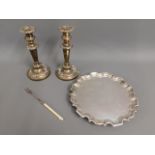 A pair of silver plated candleholders 8.75in tall,