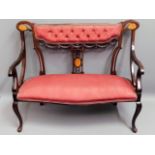 An inlaid Regency style upholstered three piece be