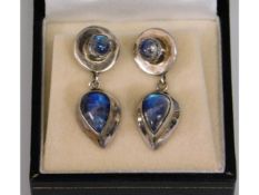 A boxed pair of white metal mounted moonstone earr