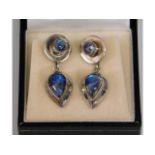 A boxed pair of white metal mounted moonstone earr