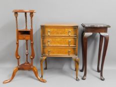 A three drawer cabinet on carbiole legs, a reproduction wash stand, 33.5in tall & a modern plant sta