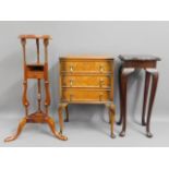A three drawer cabinet on carbiole legs, a reproduction wash stand, 33.5in tall & a modern plant sta