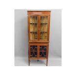 A c.1900 Regency style mahogany corner cabinet, 68