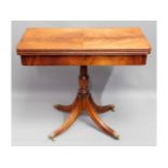 A Regency style mahogany card table with brass cla