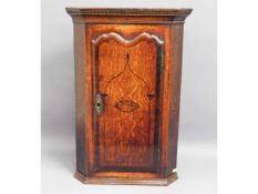 A small George III oak corner cabinet with inlaid with image of Britannia, 26in high x 18in wide x 1