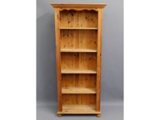 A large pine bookcase, 36.625in wide x 73.25in high x 12.875in deep £60-80