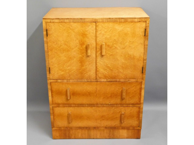 A vintage birds eye maple cabinet with two drawers & shelved cupboard over, small area of minor old