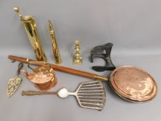 A brass shell fire poker stand, a cast iron shoe l