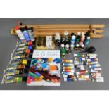 A quantity of artist paints & materials with easel