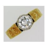 An 18ct gold solitaire ring, lively diamond approx