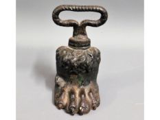 A Victorian cast iron door stop in form of lion fo