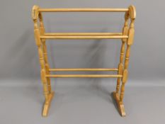 An Edwardian satinwood towel rail, 30.5in high x 24.5in wide £30-40