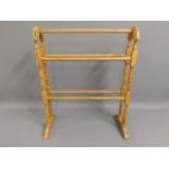 An Edwardian satinwood towel rail, 30.5in high x 24.5in wide £30-40