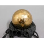 A brass globe compact, clasp stiff