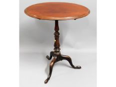 A Victorian mahogany tilt top table