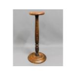 An oak torchere, 32.25in high