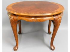 An occasional table, 21in high x 27.75in wide x 23