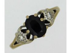 An 18ct white gold ring set with diamond & sapphir