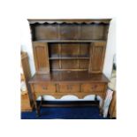 A Georgian style oak dresser with three drawers &