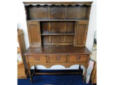 A Georgian style oak dresser with three drawers &