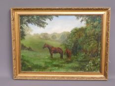 A framed oil of horses in wooded field, signed W.