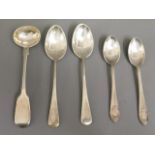 A silver master salt spoon, two silver tea spoons,