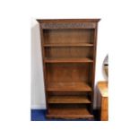 An Old Charm oak bookcase (one set of shelf pins missing), 73.75in high x 39in wide x 13in deep