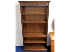 An Old Charm oak bookcase (one set of shelf pins missing), 73.75in high x 39in wide x 13in deep