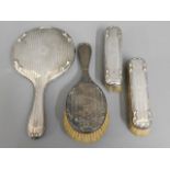 A silver backed dressing table set