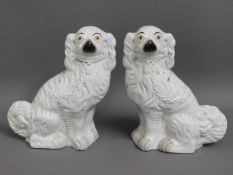 A pair of 19thC. Staffordshire dogs, 11.875in tall